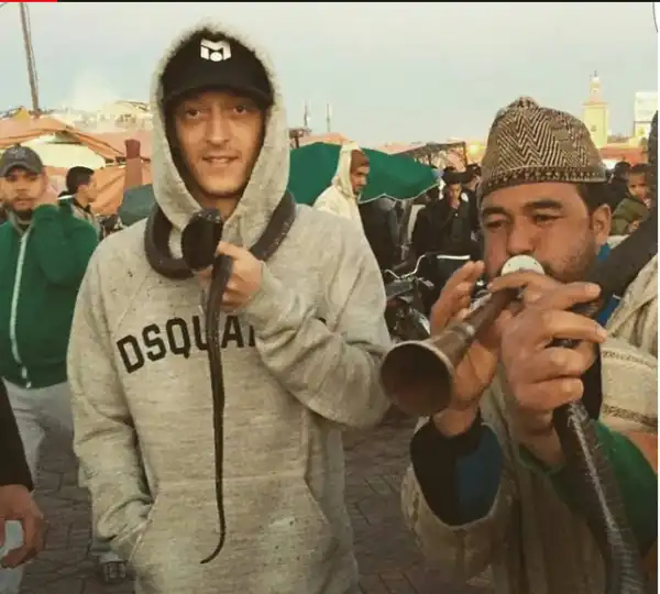 Arsenal Playmaker, Mesut Ozil Poses With A Live Cobra